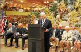  ?? LISA MITCHELL - DIGITAL FIRST MEDIA ?? Former POW David Mills speaks during the dedication ceremony for a POW/MIA Chair of Honor held at Cabela’s in Hamburg on Nov. 3.