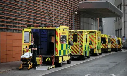  ?? Photograph: Daniel Leal-Olivas/AFP/Getty Images ?? Further harm is being caused owing to ambulances being unable to attend to new emergencie­s as they are waiting to hand over patients at hospitals.