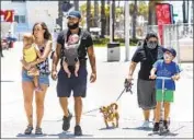  ?? Mel Melcon Los Angeles Times ?? L AU R I E St. Anant, left, and her family Lalla Nolden, Tyree Noldon and Jaxon visit Santa Monica.