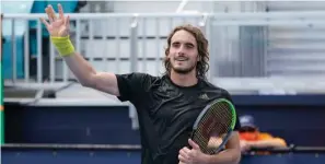  ?? The Associated Press ?? ■ Stefanos Tsitsipas of Greece waves to the crowd after defeating Damir Dzumhur of Bosnia Saturday during the Miami Open in Miami Gardens, Fla.