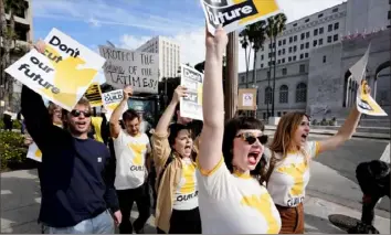  ?? Richard Vogel/Associated Press ?? Georgia Geen, front, multiplatf­orm editor for the Los Angeles Times, joins other staffers and supporters carrying signs and chanting slogans Jan. 19 in front of City Hall in Los Angeles.