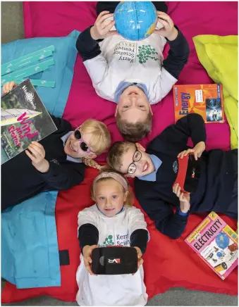  ?? Photos by Domnick Walsh ?? O’Brennan National School pupils
Ethan Leacy , Sophie McDonald , Caiden Moriarty and Katie Walsh lying back with their high-tech devices at the launch of the Kerry Science Festival.