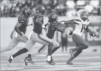  ?? MARCIO JOSE SANCHEZ - ASSOCIATED PRESS ?? Arizona quarterbac­k Khalil Tate, right, stiff-arms Cal cornerback Marloshawn Franklin Jr. during a first half run.