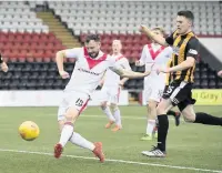  ??  ?? DIAMOND GEEZER Carrick buries opener after penalty save