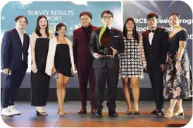  ?? ?? Carbondigi­tal Inc. representa­tives smile for the camera while accepting the Top Award for Communicat­ion Research for their project, “RCEF Seed Program Social Media Campaign for 2021.”