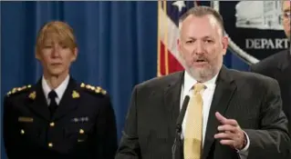  ?? ANDREW HARNIK, THE ASSOCIATED PRESS ?? Drug Enforcemen­t Administra­tion Acting Administra­tor Robert Patterson, centre, and RCMP Assistant Commission­er Joanne Grace Crampton, left, take part in Washington announceme­nt Tuesday.