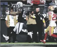  ?? ERIK VERDUZCO/LAS VEGAS REVIEW-JOURNAL ?? Raiders tight end Darren Waller (83) makes a touchdown catch ahead of 49ers safety Talanoa Hufanga (29) in Las Vegas on Jan. 1.