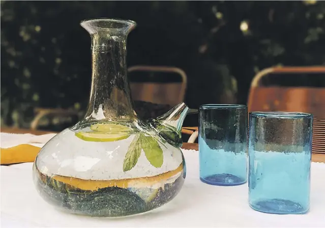  ?? Photos Ziad Abi Chaker ?? Ziad Abi Chaker’s initiative has transforme­d glass debris into carafes, jars, ibriks and tumblers