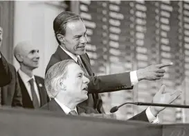  ?? Eric Gay / Associated Press file ?? Gov. Greg Abbott, front, and Speaker of the House Joe Straus, R-San Antonio, at the opening of the 85th Texas legislativ­e session.