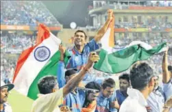  ?? SANTOSH HARHARE/ HINDUSTAN TIMES ?? Sachin Tendulkar carried by team members as India wins the Cricket World Cup final in Mumbai on April 2, 2011.