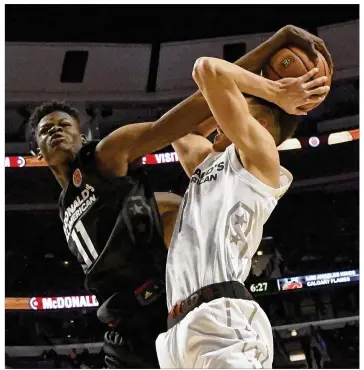  ?? DAVID BANKS / GETTY IMAGES ?? Five-star power forward Mohamed Bamba (11) already is considered a possible No. 1 overall selection in next year’s NBA draft. Bamba strengthen­s a Texas recruiting class ranked fourth nationally.