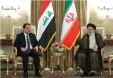  ?? — AFP photo ?? A handout photo provided by the Iranian presidency shows Raisi (right) meeting with Sudani in Tehran.