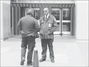  ??  ?? Police and security stand outside 30 Rockefelle­r Plaza, the location for the offices of U.S. President Donald Tump’s lawyer Michael Cohen which was raided by the F.B.I. today in the Manhattan borough of New York City, New York, U.S., April 9, 2018....