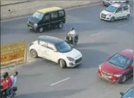  ?? ?? A commuter is seen driving on the wrong side of the road to take a short cut to reach their destinatio­n, near NH 24 on Sunday.