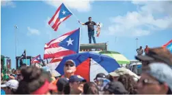  ?? DENNIS M. RIVERA PICHARDO/AP ?? Thousands of Puerto Ricans gather Monday in San Juan for one of the biggest protests ever seen in the U.S. territory.