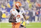  ?? CHUCK BURSON/ASSOCIATED PRESS ?? Clemson wide receiver Justyn Ross (8) helped the Tigers win the ACC title and have an unbeaten season. They are the No. 2 seed.