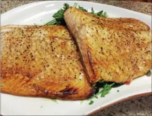  ?? PHotoS By MiCHileA PAtteRSoN — DiGitAl FiRSt MeDiA ?? this baked salmon dish is prepared using only five ingredient­s.