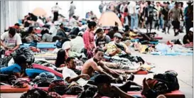  ?? ALFREDO ESTRELLA/GETTY-AFP ?? Migrants from one caravan rest at a temporary shelter set up in a Mexico City stadium.