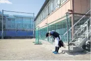  ??  ?? Ryoma Ouchi bows to the baseball field after a workout in Fukushima.
