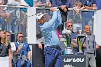  ?? AP PHOTO/ALASTAIR GRANT ?? Charl Schwartzel hits a tee shot during Saturday’s final round of the inaugural LIV Golf Invitation­al at the Centurion Club near London.