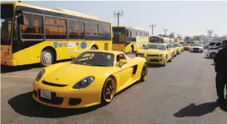  ??  ?? KUWAIT: Yellow vehicles participat­e in a parade during the initiative.— Photos by Yasser Al-Zayyat
