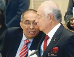  ??  ?? ... Communicat­ions and Multimedia Minister Salleh Said Keruak speaking to Prime Minister Datuk Seri Najib Razak during the 28th Multimedia Super Corridor Implementa­tion Council Meeting in Perdana Putra in Putrajaya yesterday.