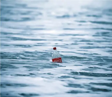  ?? (Amir Cohen/Reuters) ?? A PLASTIC BOTTLE floats in the Mediterran­ean Sea, at Zikim beach near Ashkelon.