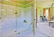  ??  ?? More homebuyers are reconfigur­ing the space once occupied by a traditiona­l tub with an oversized shower.