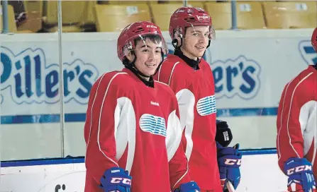  ?? MATHEW MCCARTHY WATERLOO REGION RECORD ?? Kitchener Rangers forwards Joseph Garreffa, left, and Greg Meireles stand together at practice at The Aud on Thursday.