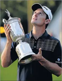  ?? Picture: GETTY IMAGES ?? BIG ONE: Justin Rose of England looks up to the heavens as he holds the US Open trophy after winning the 113th edition of the event