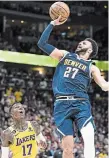  ?? WALLY SKALIJ LOS ANGELES TIMES ?? Nuggets guard Jamal Murray, right, from Kitchener, shoots against Los Angeles Lakers guard Dennis Schroder during the first half of Game 2 of the Western Conference final at Ball Arena in Denver on Thursday night.