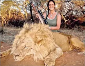  ??  ?? OUTRAGE: Melissa Bachman’s picture of herself with the lion she killed at the Maroi Conservanc­y.