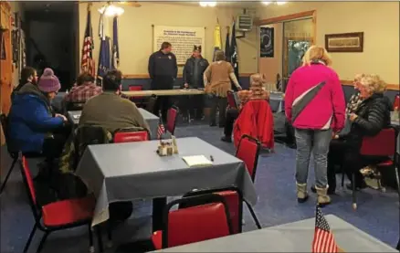  ?? CHARLES PRITCHARD - ONEIDA DAILY DISPATCH ?? Members of the Munnsville American Legion wait for the last few people to show up before Jan. 8meeting