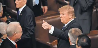  ?? JJACK GRUBER, USA TODAY ?? President Trump acknowledg­es the crowd after addressing a joint session of Congress on Tuesday night. Some praised the conciliato­ry tone of the speech, others questioned his sincerity.