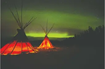  ?? GREG OLSEN ?? Tour operators in Whitehorse take people outside the city to heated yurts to stay warm while waiting for the northern lights to appear. Many Northern Canadian communitie­s are ideal spots to see the lights.