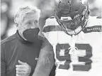  ?? RICH BARNES/ USA TODAY SPORTS ?? Seahawks coach Pete Carroll talks with defensive end Jonathan Bullard after the loss.