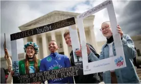  ??  ?? Youth protesters rally in support of a lawsuit brought on behalf of 21 youth plaintiffs against the US government over climate crisis. Photograph: Win McNamee/Getty Images