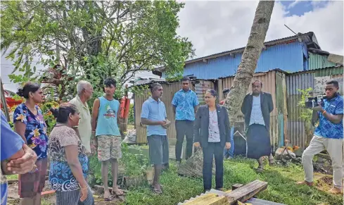  ?? Photo: DEPTFO News ?? Minister for Housing and Community Developmen­t Premila Kumar visiting the Mani family in Newtown, Nasinu.