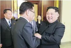  ?? — GETTY IMAGES ?? North Korean leader Kim Jong Un, right, with South Korean chief delegate Chung Eui-yong, centre, during their meeting Monday in Pyongyang.