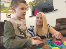  ?? ALEX SMITH / KCUR ?? Loretta Boesing, of Park Hills, Mo., plays with her son Wesley, who underwent a liver transplant in 2012. Boesing worried the potency of her son’s anti-rejection medicine could have been affected by the extremely hot weather when it was delivered.