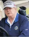  ??  ?? US President Donald Trump sits in a golf cart at the Trump National Golf Club in Sterling, Virginia,on Monday.