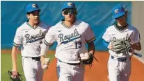  ?? ?? The First Academy senior outfielder Caden Collins (13) is pictured with teammates during a preseason game Feb. 14. The Royals, who are off to a 5-0 start, host the O-Town National Classic this week.