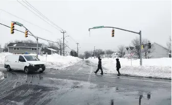  ?? ANDREW WATERMAN/THE TELEGRAM ?? Storm-related costs in St. John's will mostly be a result of increased snowcleari­ng. There is some minor wind damage to traffic lights, as well as minor damage to buildings around town, such as siding and shingles lost to the wind.