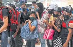  ?? REUTERS ?? People wait for buses to the provinces a day before New Year’s Eve last year at a terminal in Paranaque City, Metro Manila.