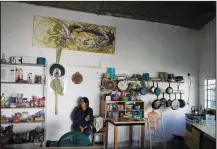  ?? ?? Artist Luz Asturizaga takes a break July 30 at the Siqueiros School in Poxindeje, Mexico. The school is located in a converted elementary school.