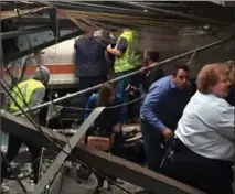  ?? PANCHO BERNASCONI, GETTY IMAGES ?? Passengers flee a NJ Transit train that crashed in to the station at the Hoboken Terminal. One person died and more than 100 were injured.