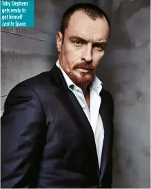  ??  ?? Toby Stephens gets ready to get himself Lost In Space.