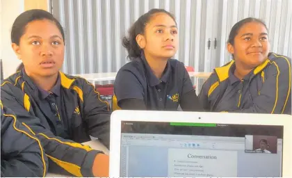  ?? Picture / Simon Collins ?? Mangere Central students Sala Agalava (left) Suialofain­a Taula and Veronika Troon-Smith are among 15 at their school learning the Tagalog language of the Philippine­s through an online learning network.