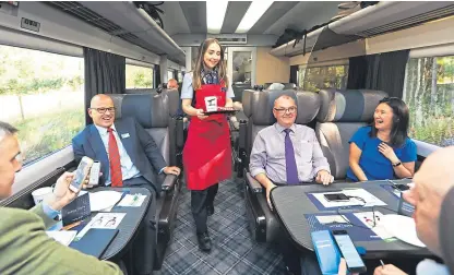  ?? Pictures: Mhairi Edwards. ?? Hospitalit­y assistant Brooklyn Kerr supplies drinks in the first class cabin.