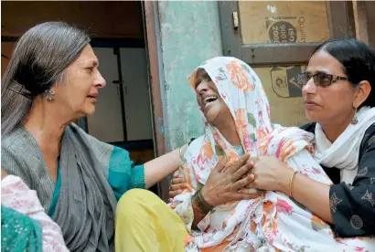  ?? PTI ?? Communist Party of India (Marxist) Polit Bureau member Brinda Karat consoling Zaira, mother of Junaid who was killed by a mob while onboard a train, in Haryana, on Saturday. —